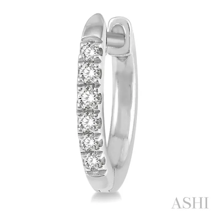 1/8 ctw Round Cut Diamond Huggie Earrings in 10K White Gold